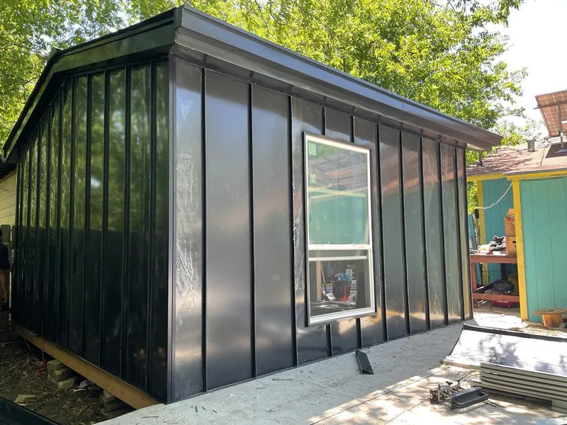 Black standing seam metal wall panels for Roof Inspection in Forestdale